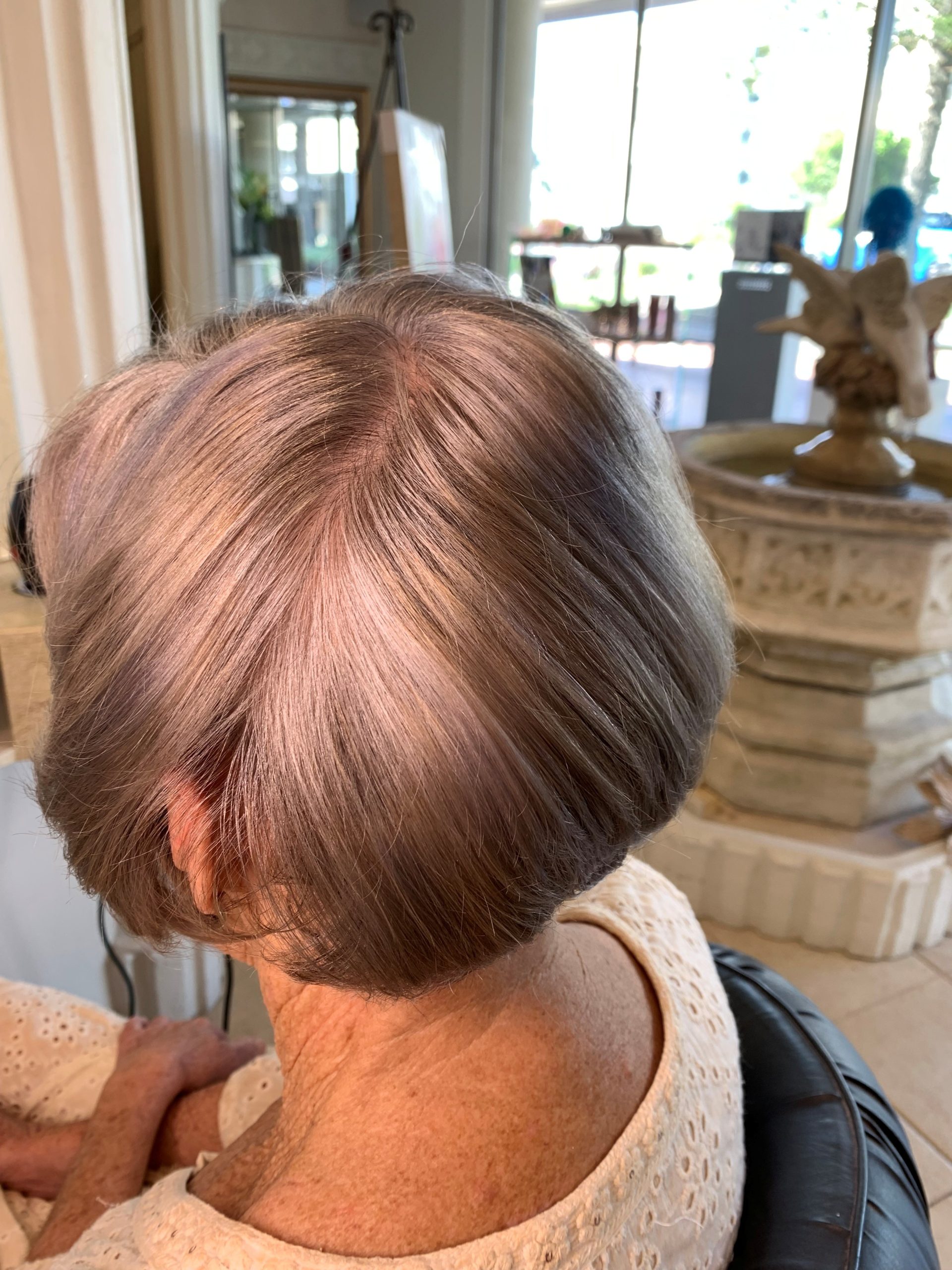 Final grey blending result showing soft natural silver tones after colour correction at Salon Maggie G Tweed Heads.