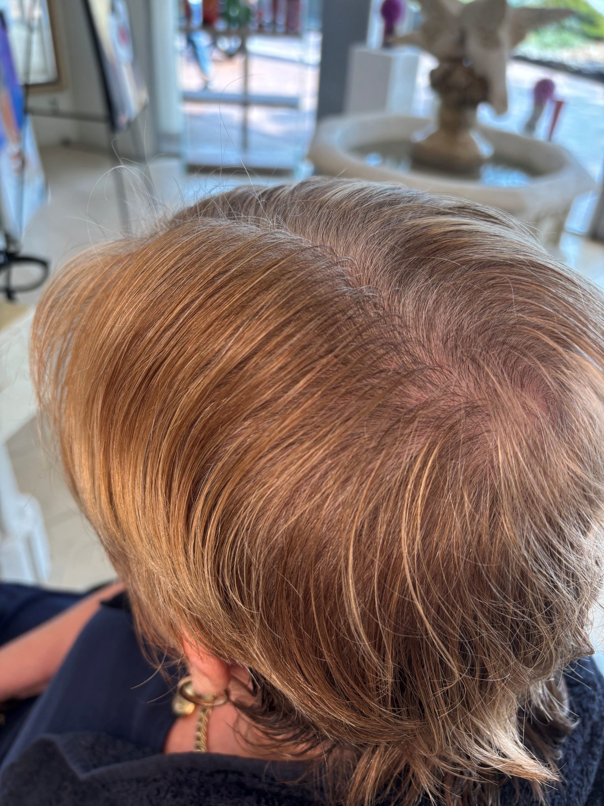 Grey blending before and after showing natural brunette